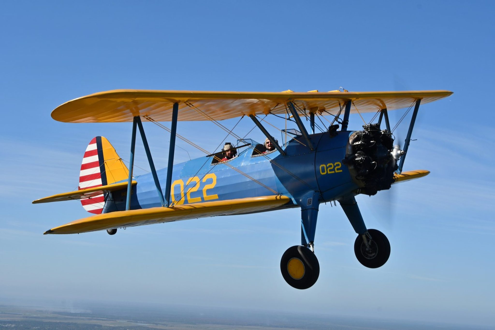1941 Army Stearman biplane in flight over St. Petersburg